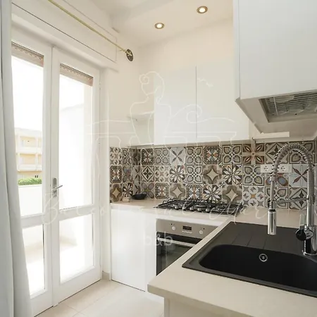 Faro Bianco Апартаменти *